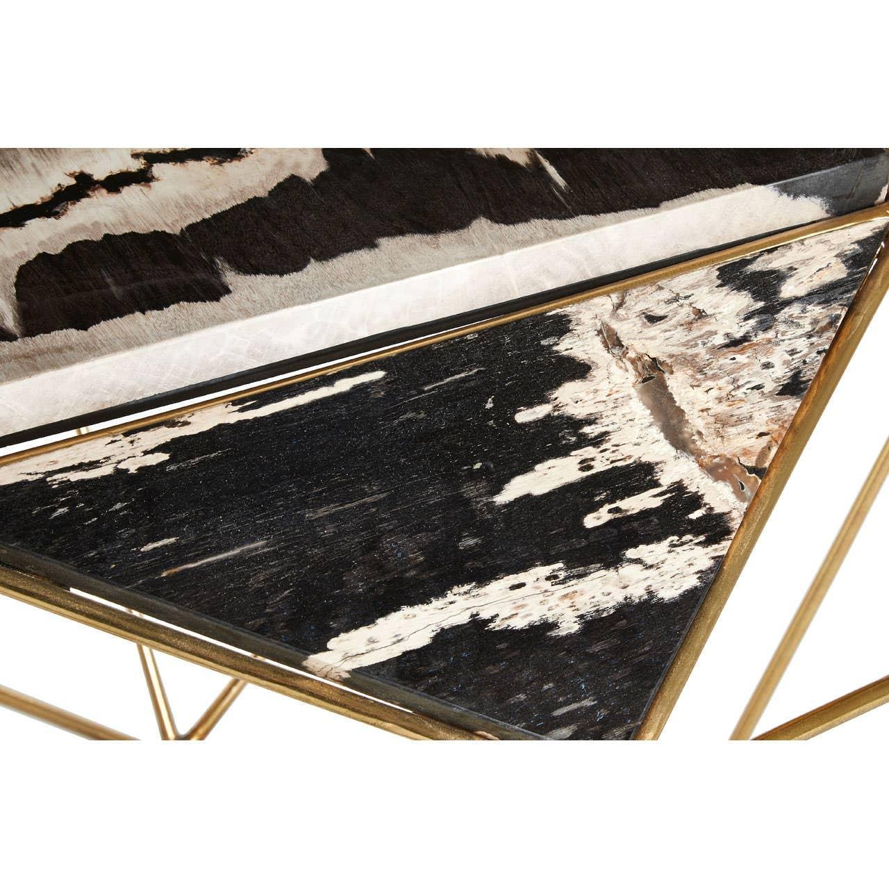 Triangular coffee table with gold frame and black and white faux cowhide top detail