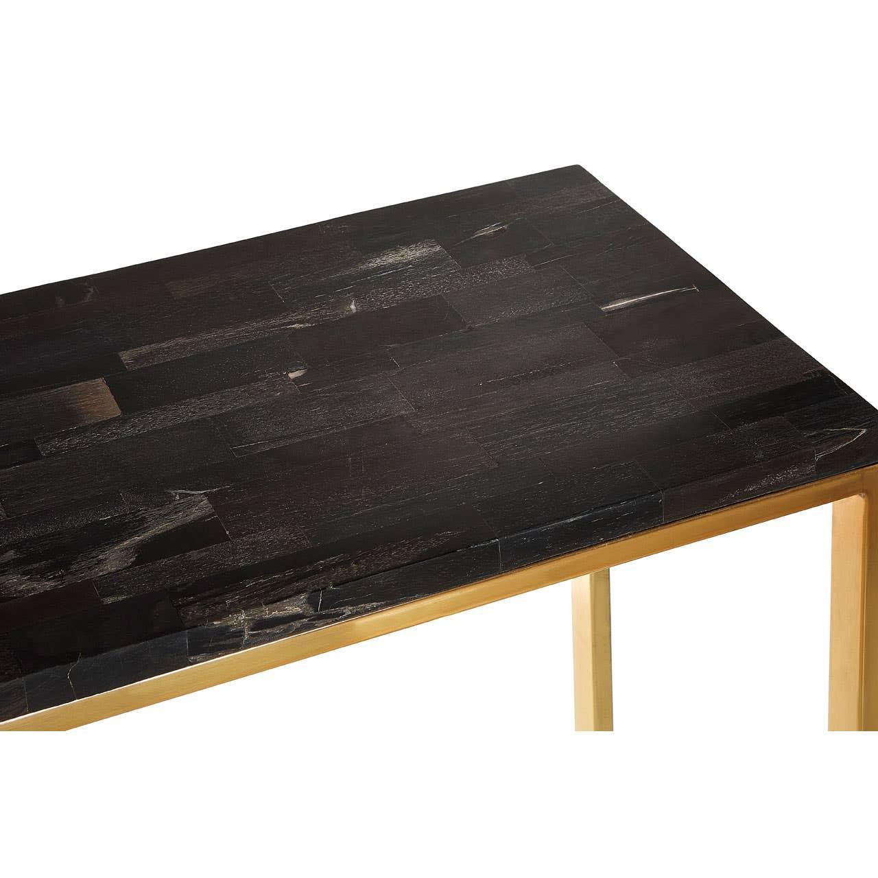 Dark wood dining table with gold metal legs, corner view