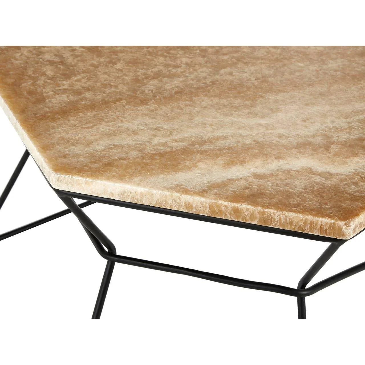 Hexagonal marble coffee table with black metal frame, close-up of tabletop and edge