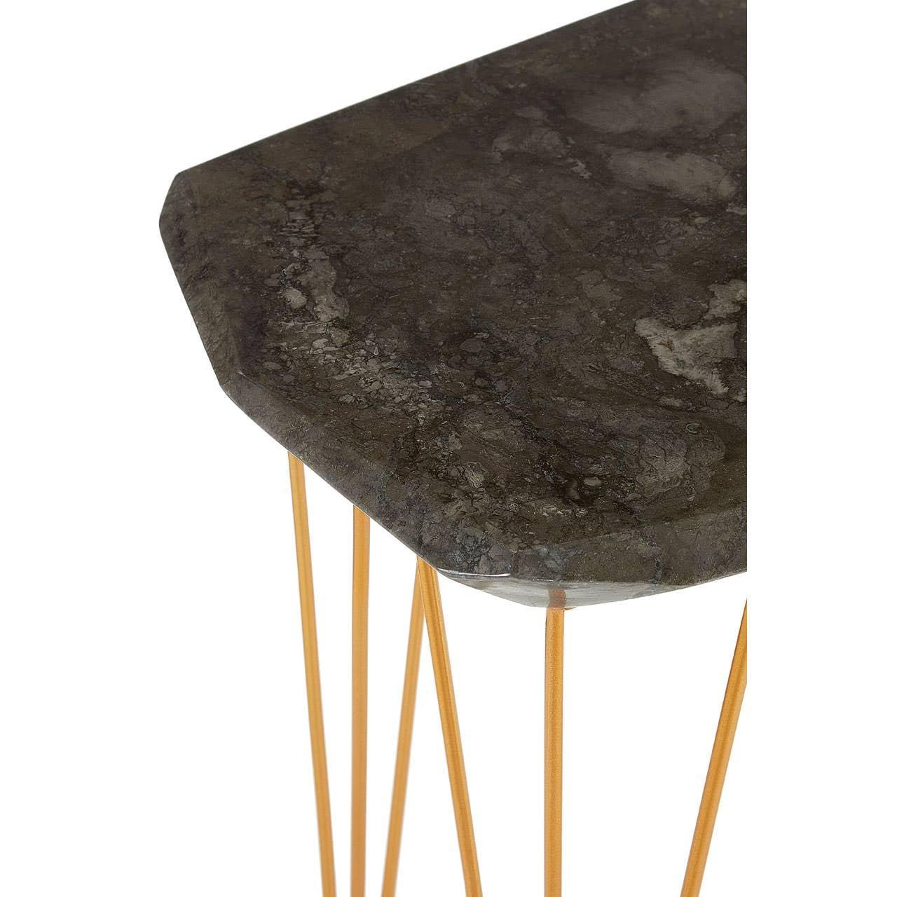 Dark marble side table with gold metal legs, angled view showing tabletop texture