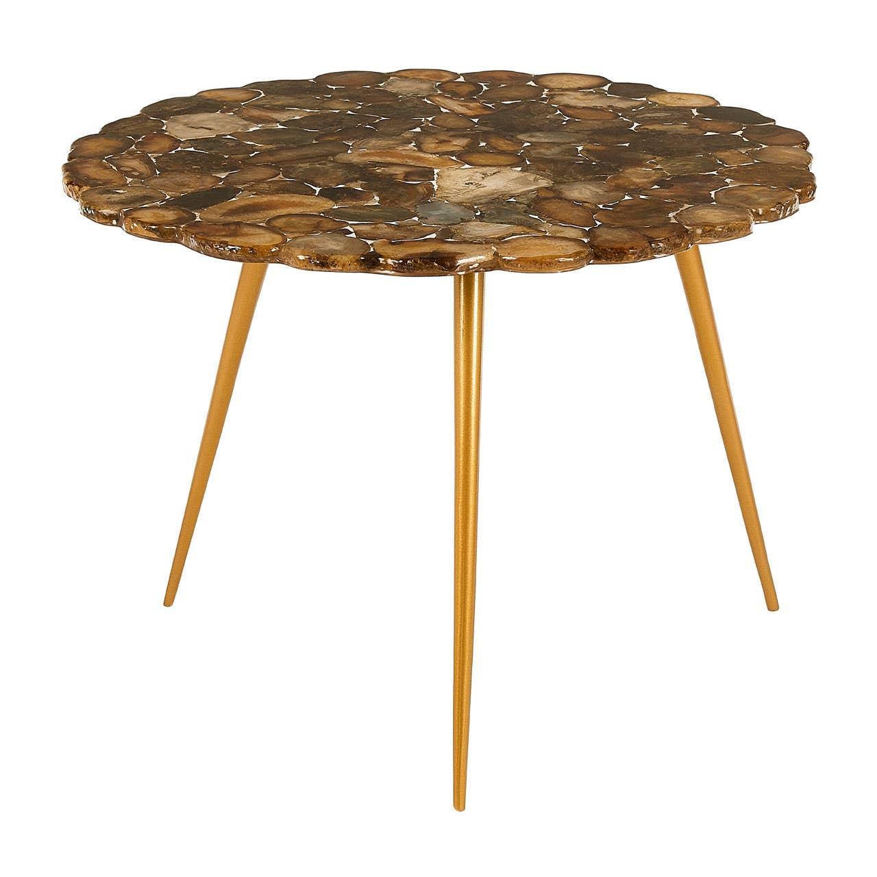 Round accent table with gold metal legs and petrified wood top