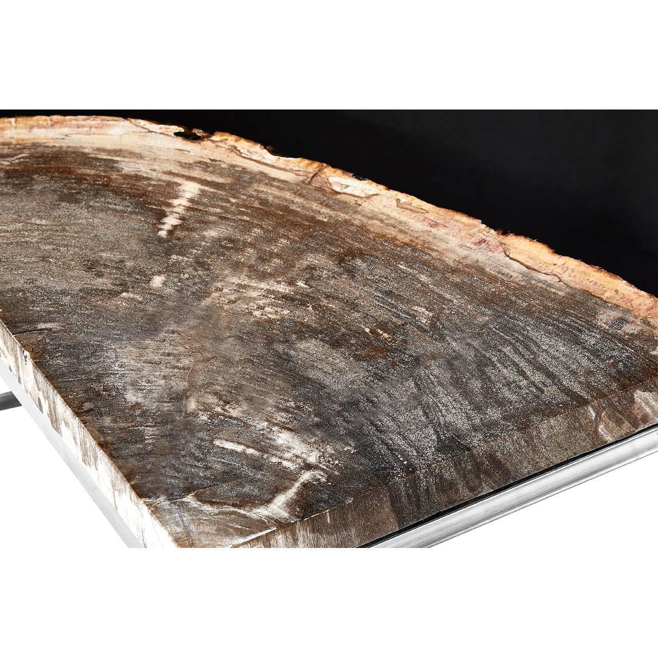 Live edge wooden table top with natural grain and polished metal edge detail