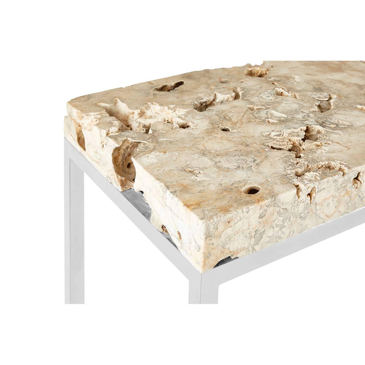 Rectangular travertine stone top table with chrome metal frame, close view of corner