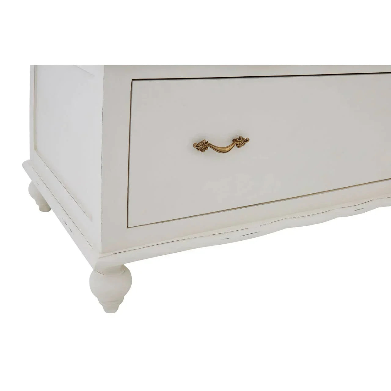 Close view of cream wooden drawer with gold handle and carved bun feet