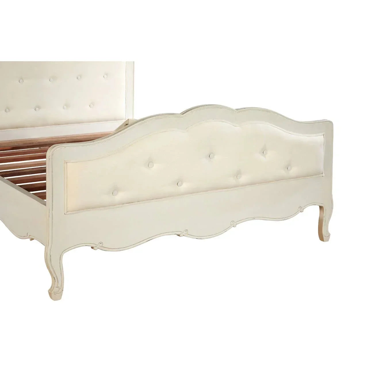 Cream upholstered bed frame with button tufted headboard and footboard, wood slats visible