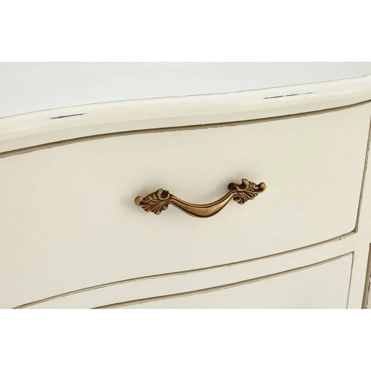 Cream furniture drawer with ornate brass handle and distressed detail