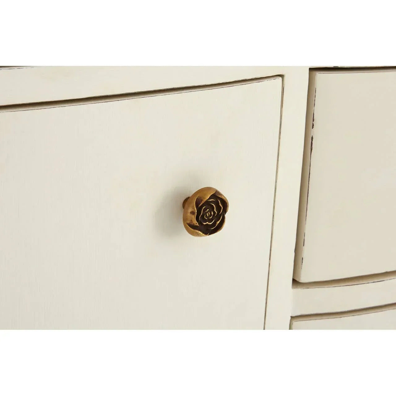 Cream wood cabinet drawer with gold rose shaped knob detail