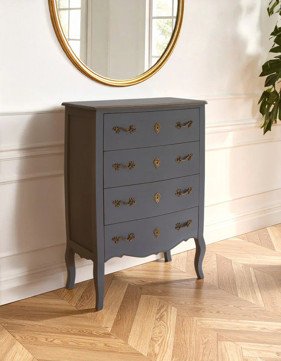 Dark grey chest of drawers with ornate gold handles in classic interior setting