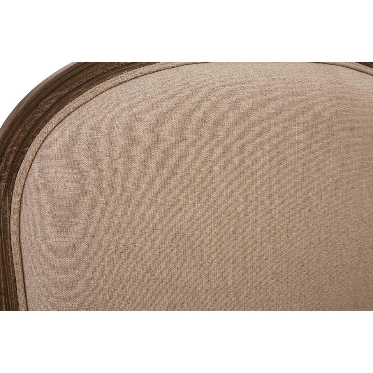 Beige upholstered chair backrest with dark wooden frame close-up