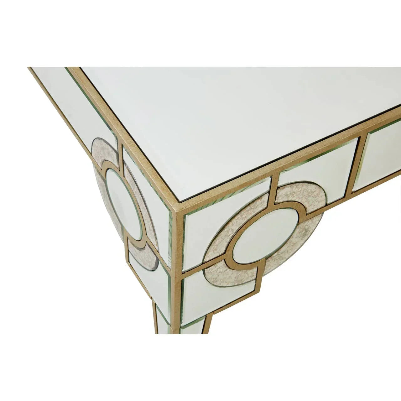 Mirrored console table corner with gold geometric trim and circular motif