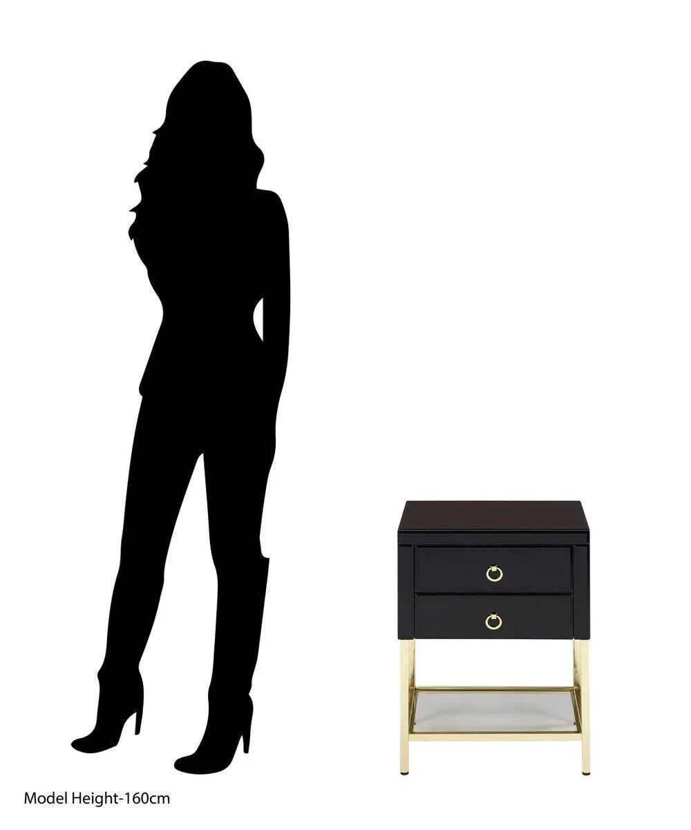 Black and gold bedside table with two drawers and lower glass shelf beside model silhouette