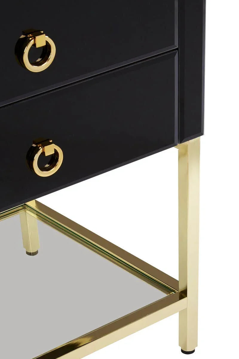 Black bedside table with gold handles and legs, mirrored lower shelf, close view