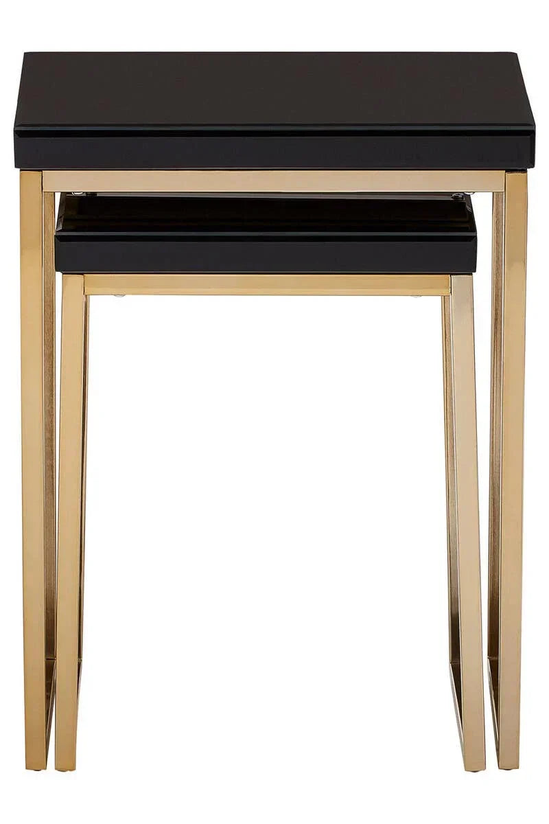 Black glass nesting tables with gold metal frame, stacked front view
