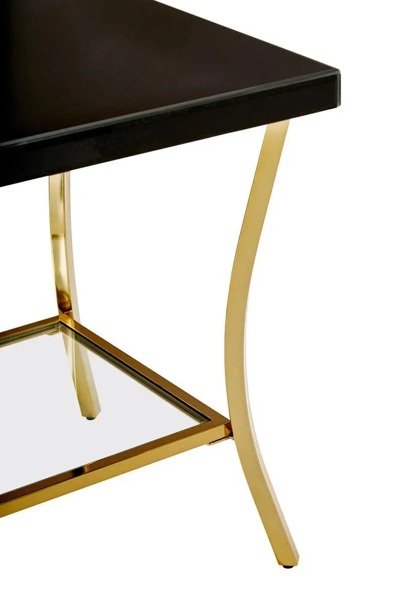 Black coffee table with gold metal legs and lower glass shelf corner detail