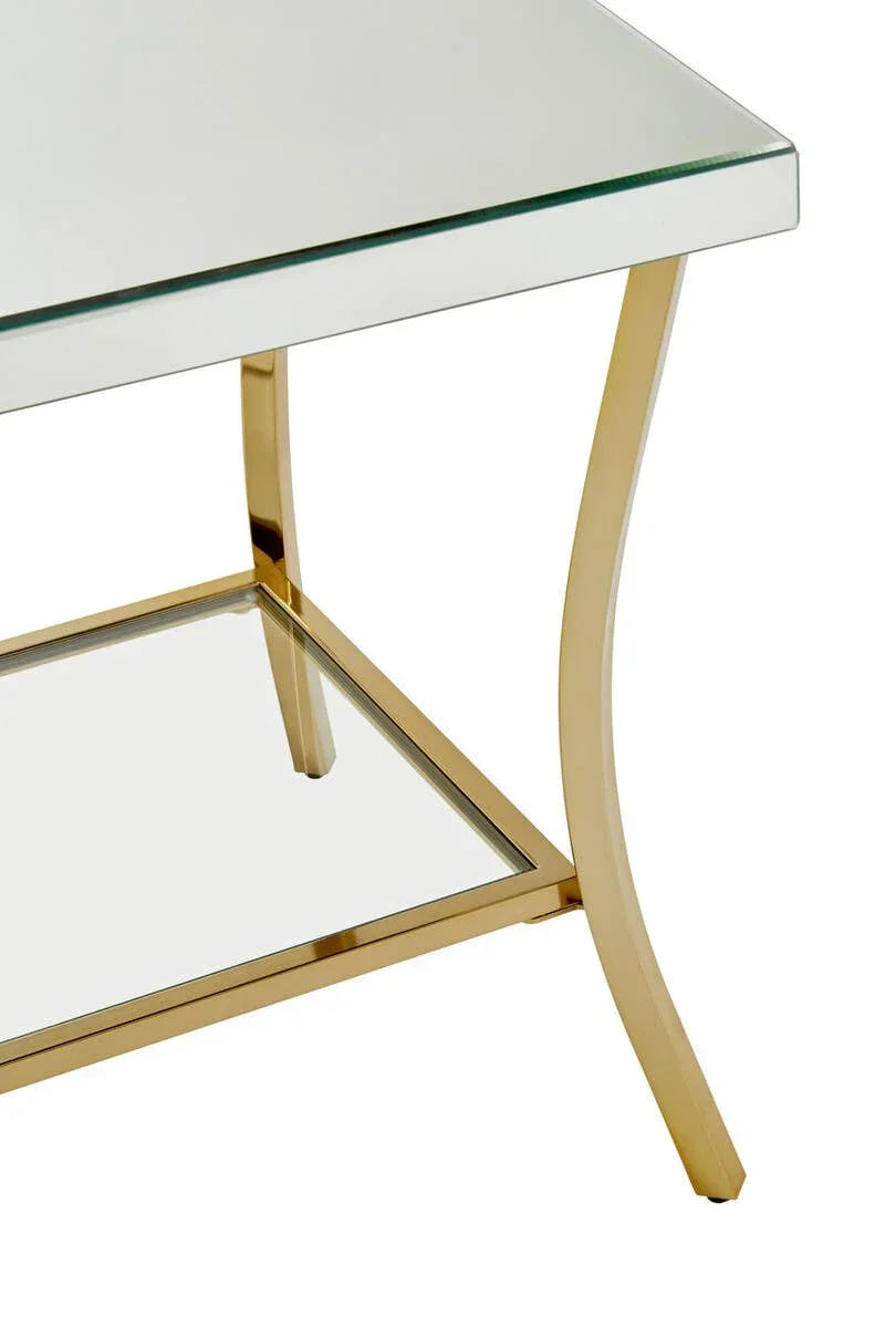 Glass coffee table with gold metal frame and lower glass shelf, angled corner view