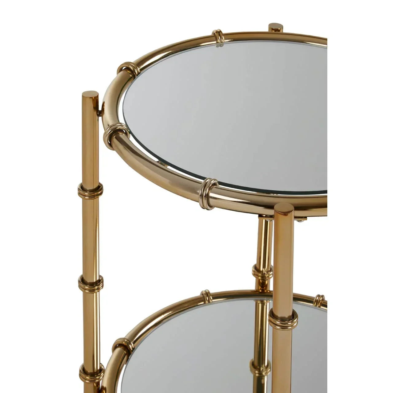 Round glass side table with gold metal frame and two mirrored shelves, close-up view