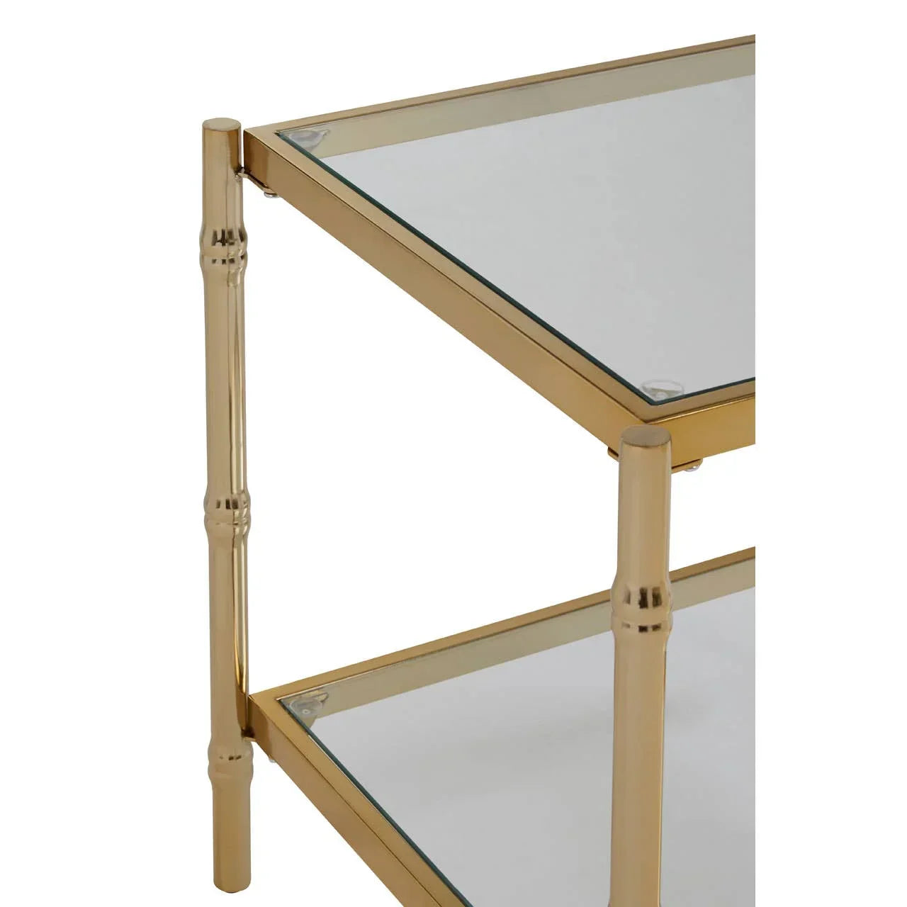 Gold metal side table with two glass shelves, close-up of frame and corner detailing