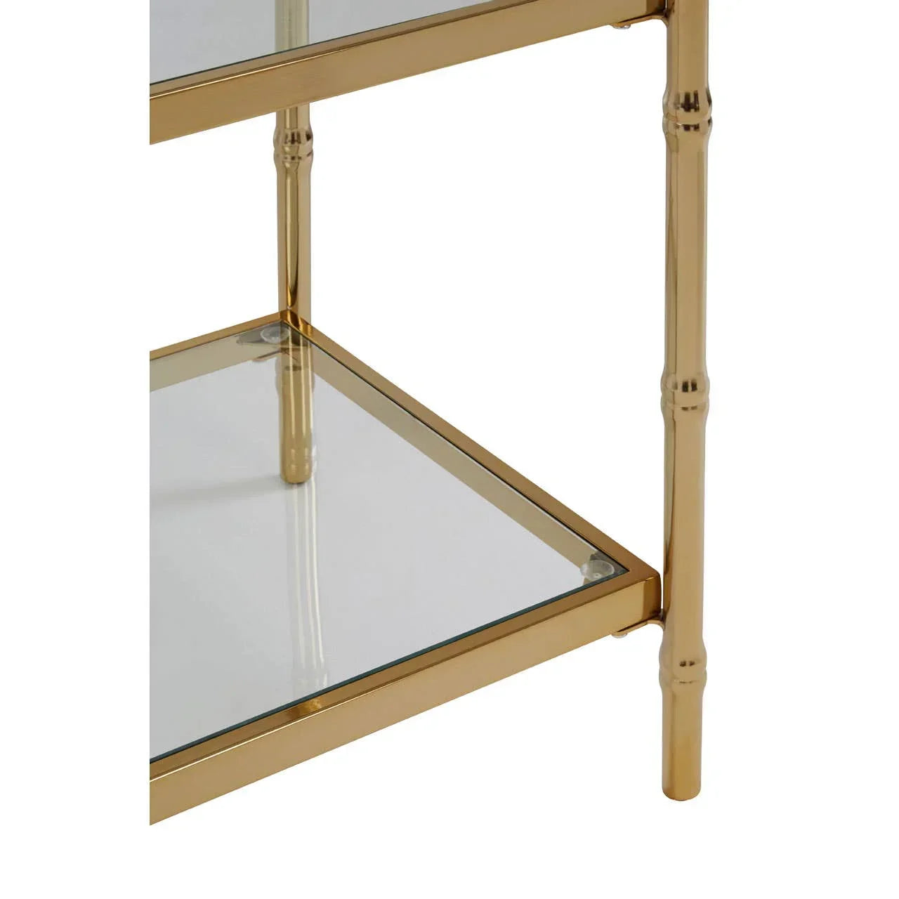 Glass shelving unit with gold metal frame and bamboo-style legs, close up corner view