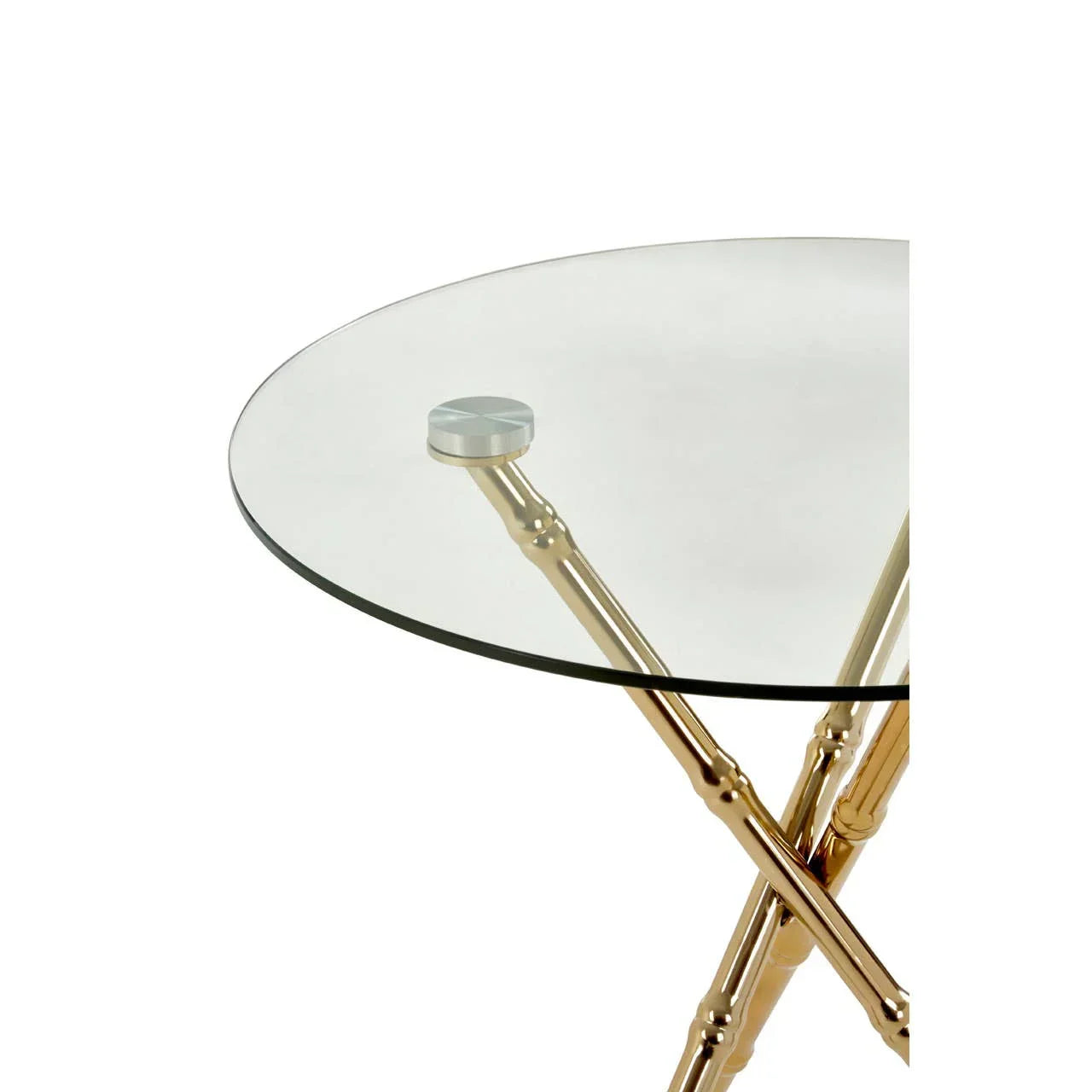 Round glass side table with gold metal legs in bamboo style, close-up corner view