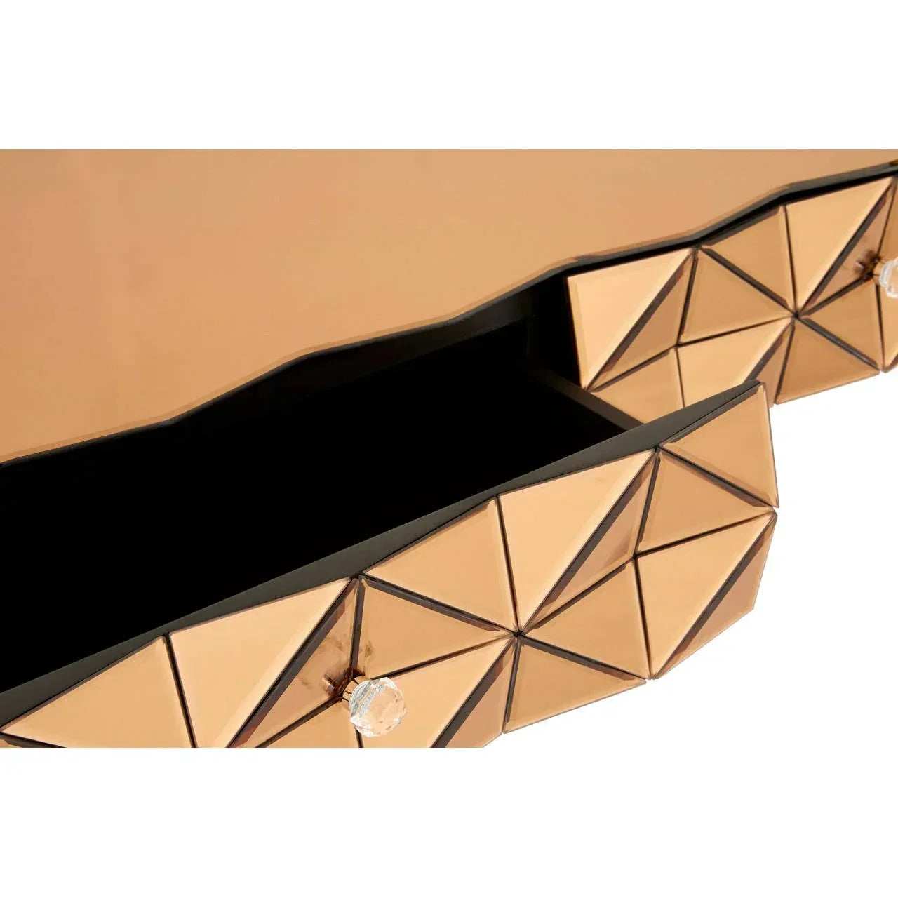Geometric mirrored drawer front with gold finish and crystal knob, close-up view