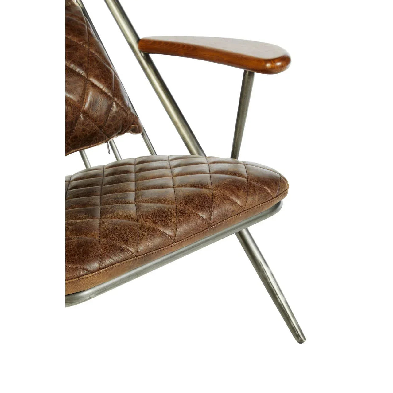 Brown leather armchair with quilted seat, metal frame and wood armrest detail close up