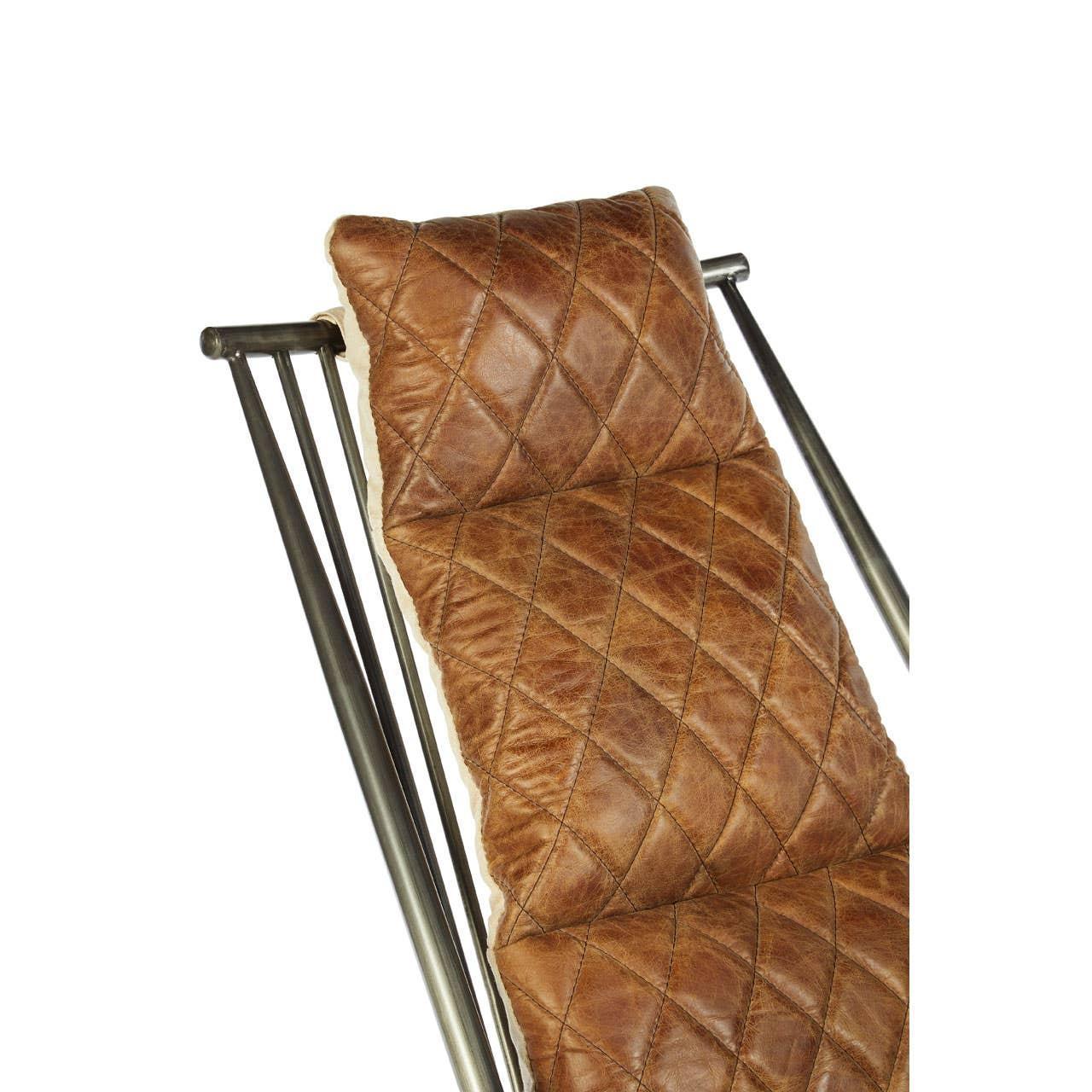 Brown quilted leather chair cushion with diamond stitching on metal frame