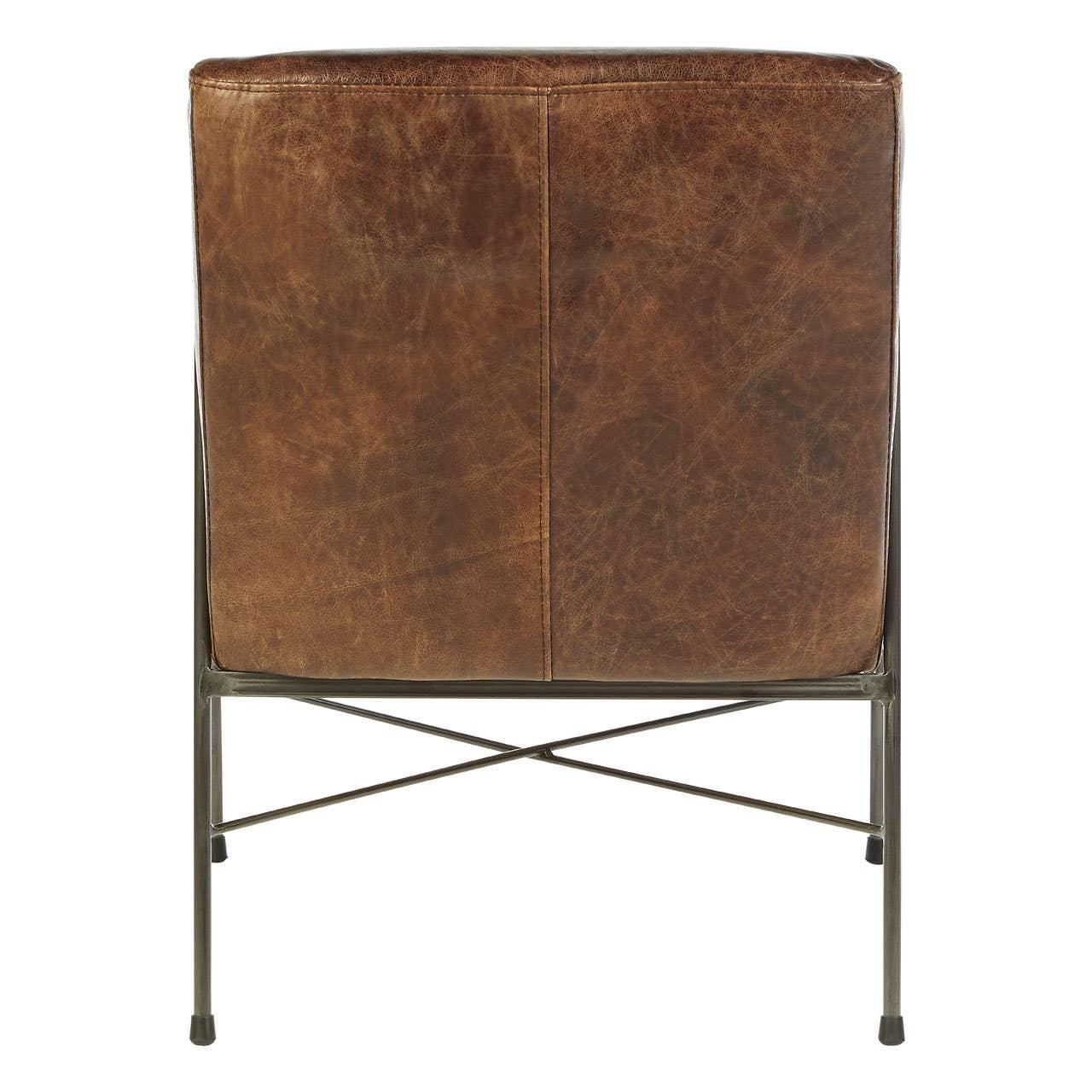 Back view of brown leather dining chair with slim black metal legs