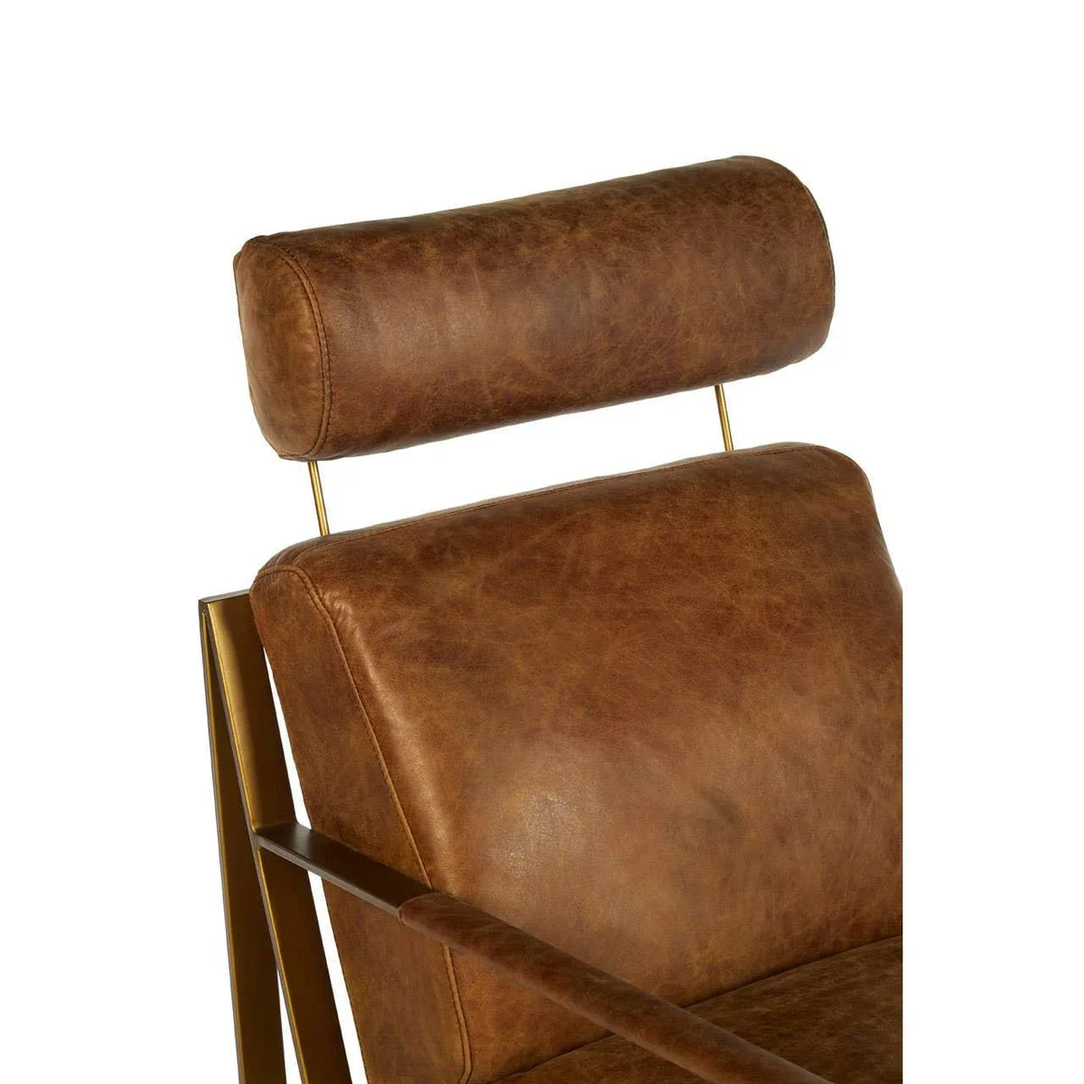 Brown leather armchair with metal frame and padded headrest close-up