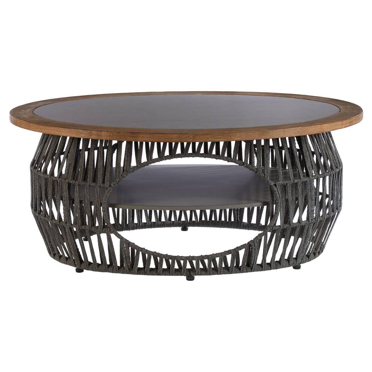 Round coffee table with wood top, woven rattan sides, and lower black shelf