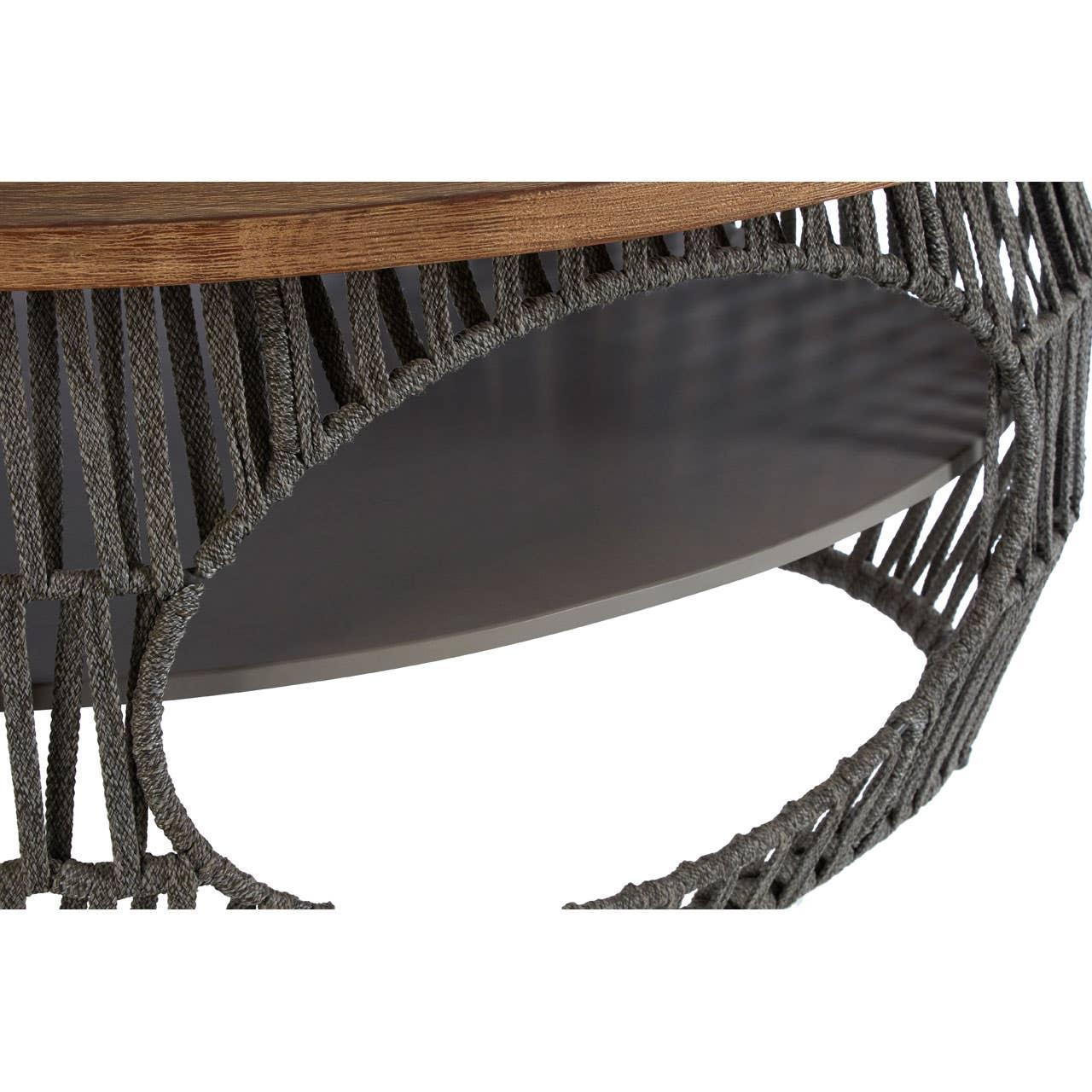 Round coffee table with wooden top and grey rope woven metal base, close-up view