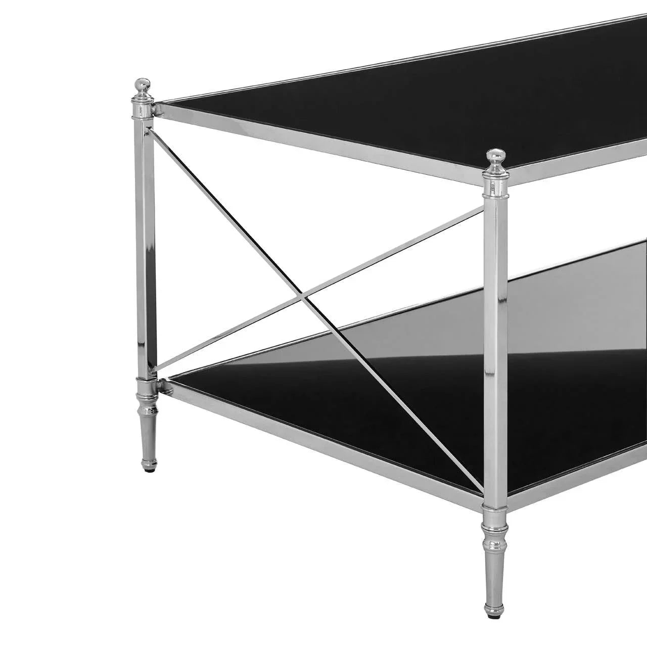 Chrome and black glass coffee table corner showing metal frame and crossed supports