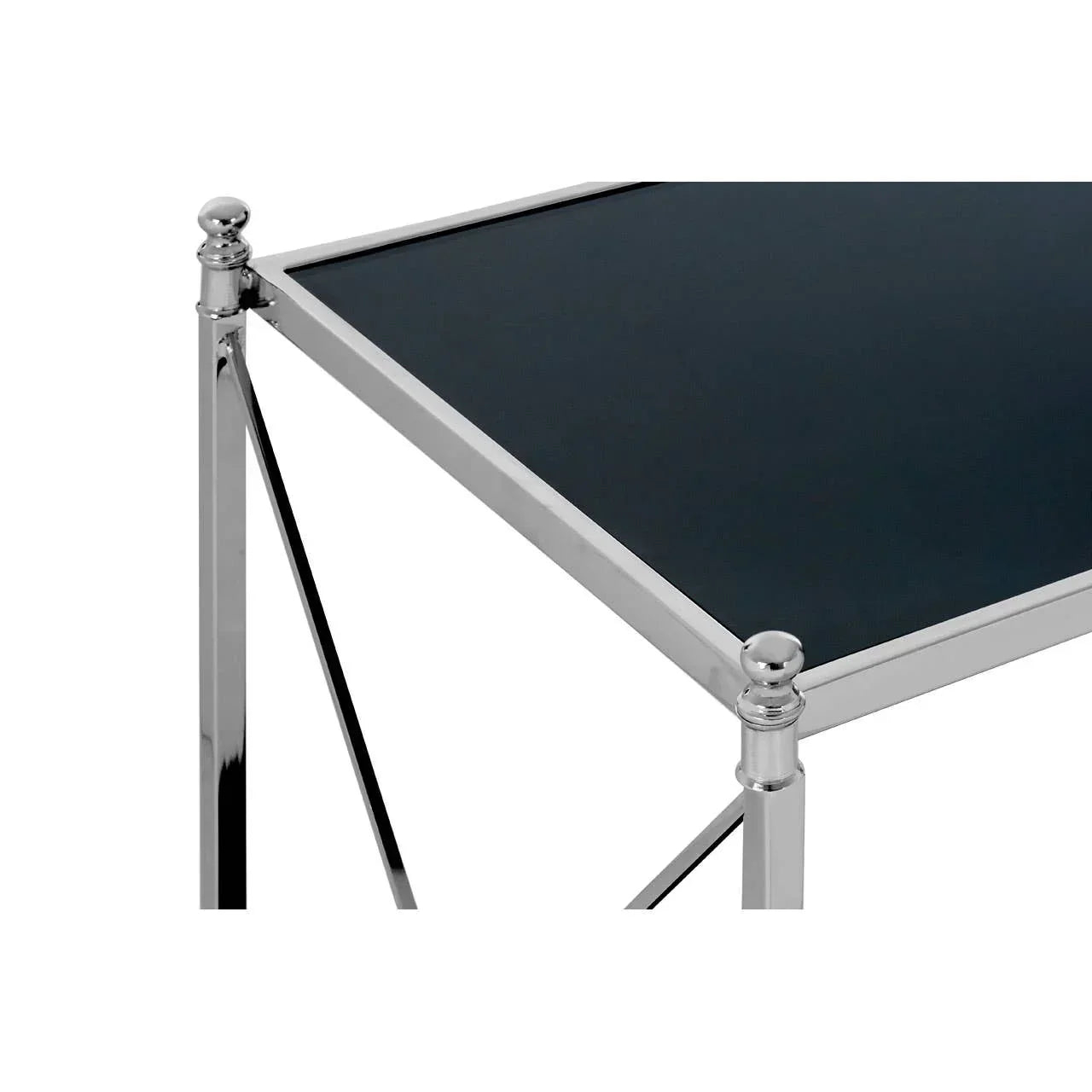 Chrome side table with black glass top, close view of corner and legs
