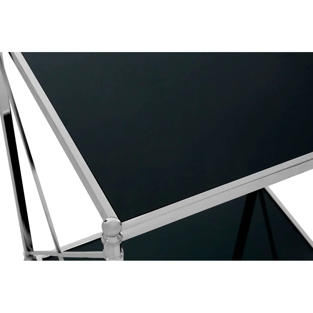 Chrome and black glass side table with metal frame, two-tier shelving close-up