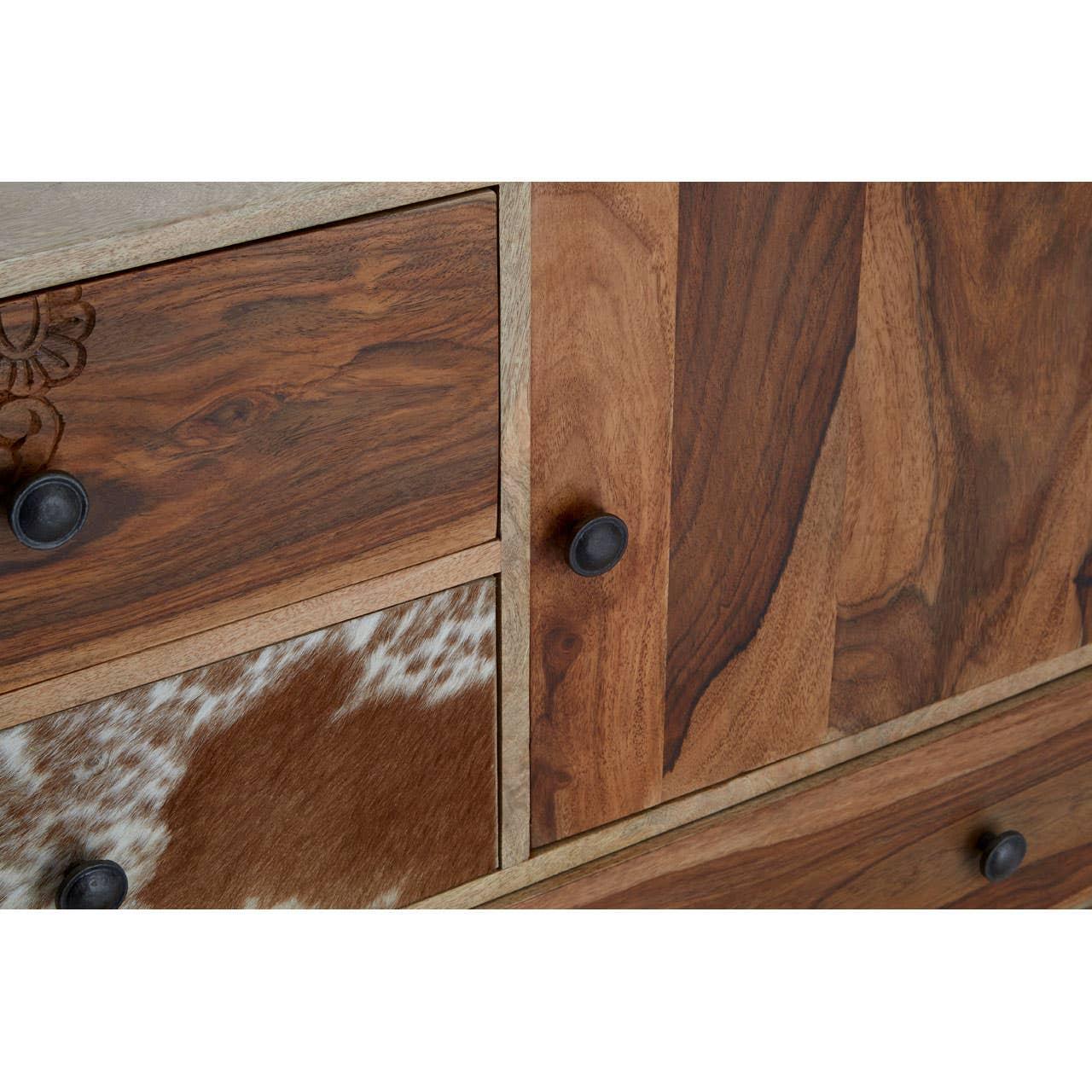 Close view of wood and cowhide sideboard drawers with black round cabinet handles