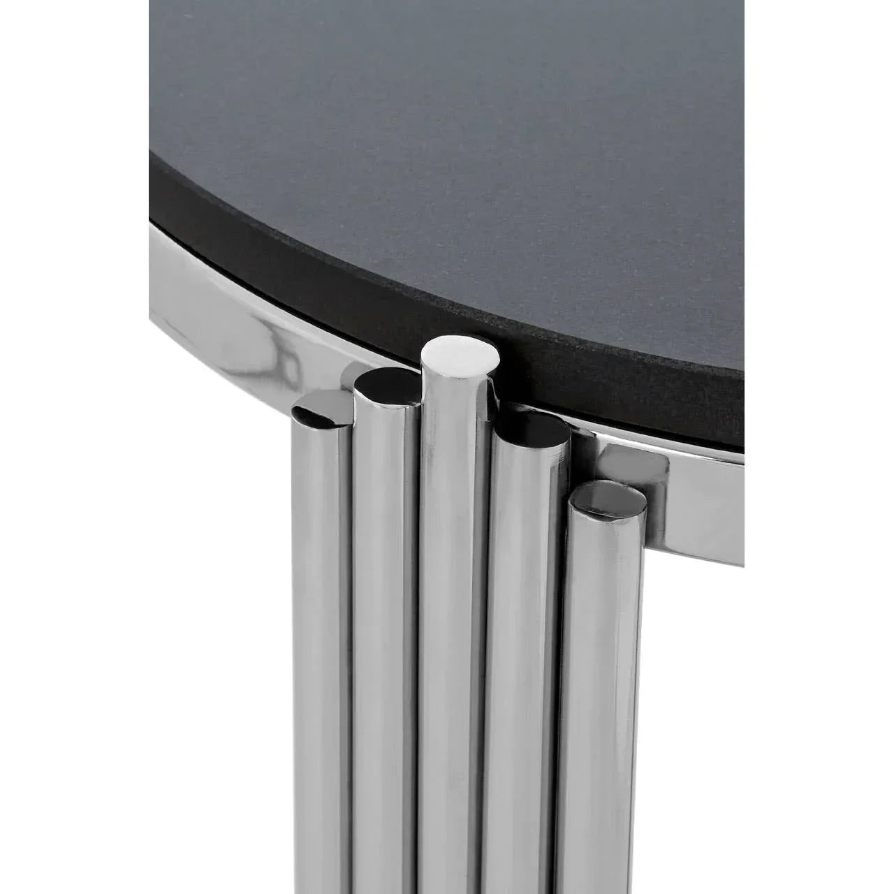 Chrome metal coffee table base with round black tabletop, close-up on leg detail