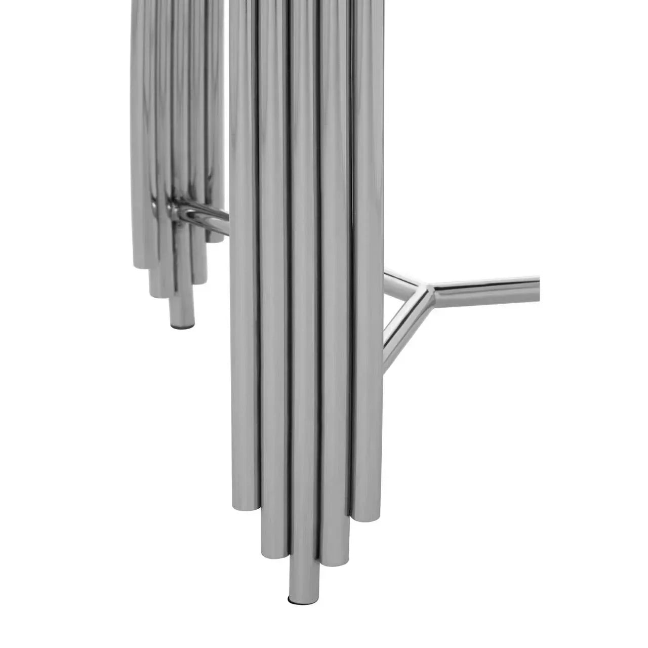 Close-up of chrome metal table legs with tubular design