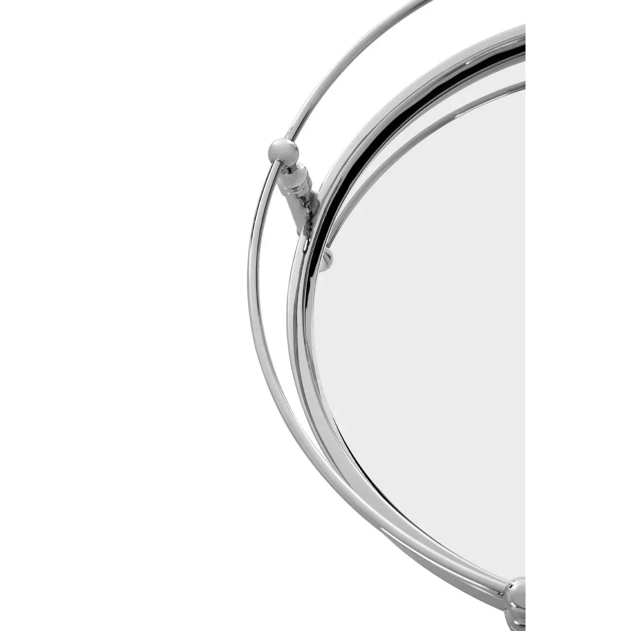 Closeup of round chrome frame mirror with adjustable stand detail
