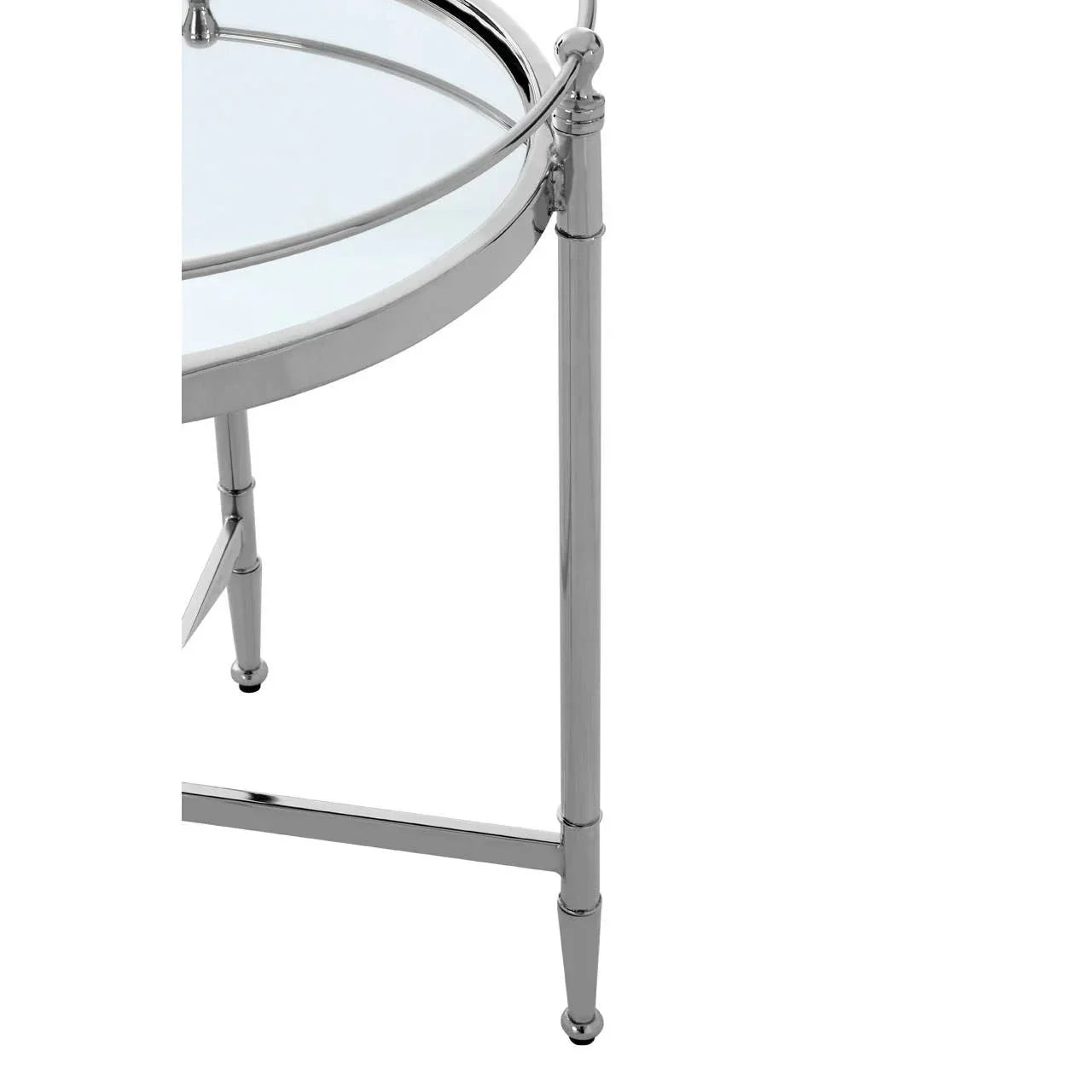 Round glass side table with chrome metal frame and three legs, close-up corner view