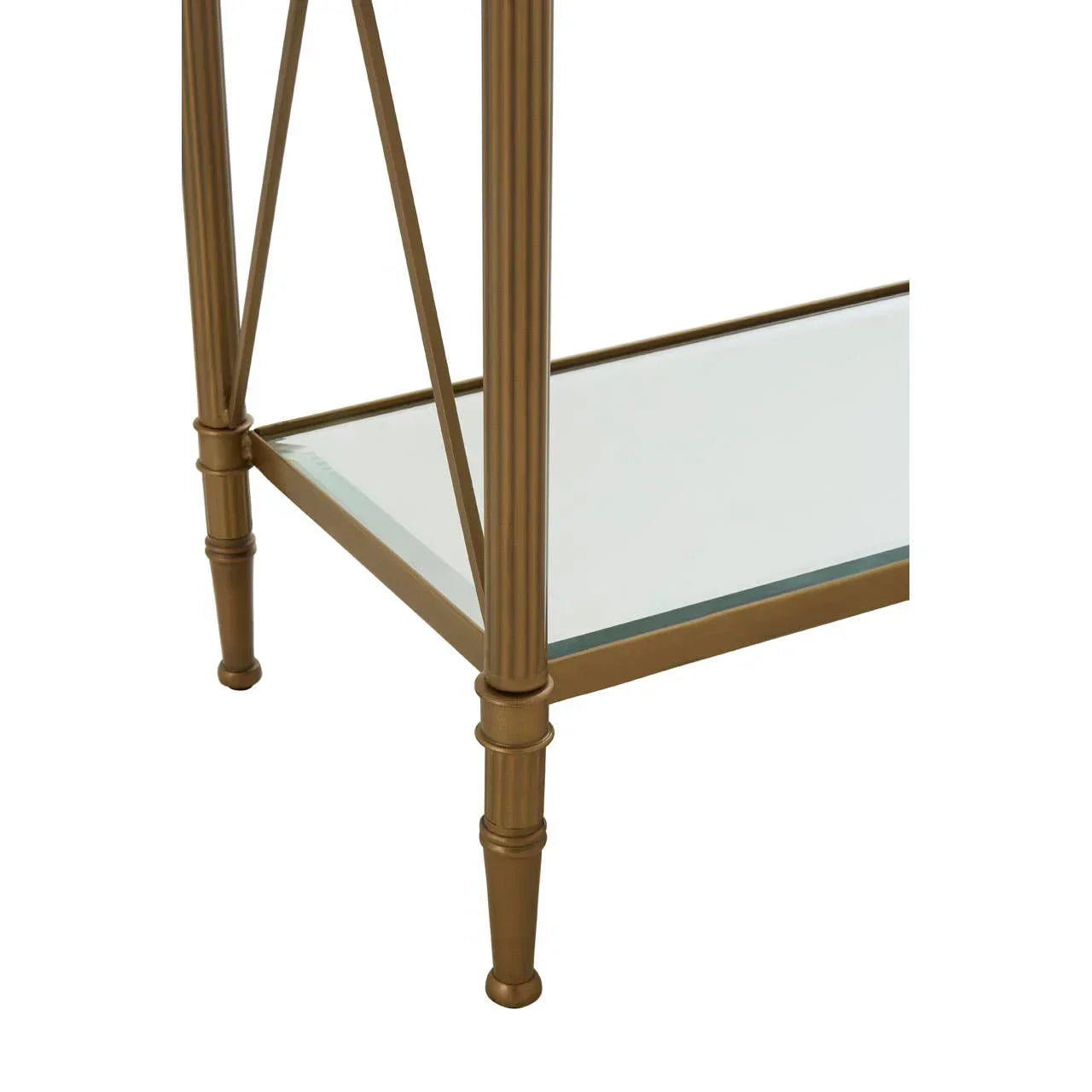 Gold metal table leg with fluted detailing and clear glass shelf