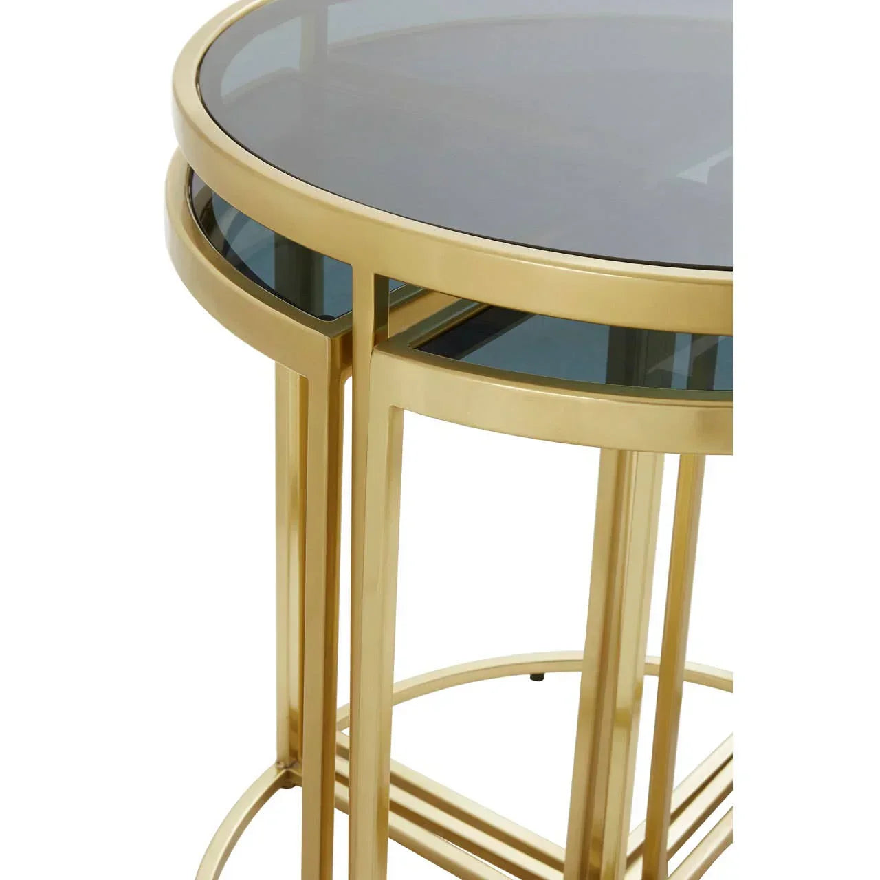 Round side table with gold metal frame and smoked glass top, close-up angle