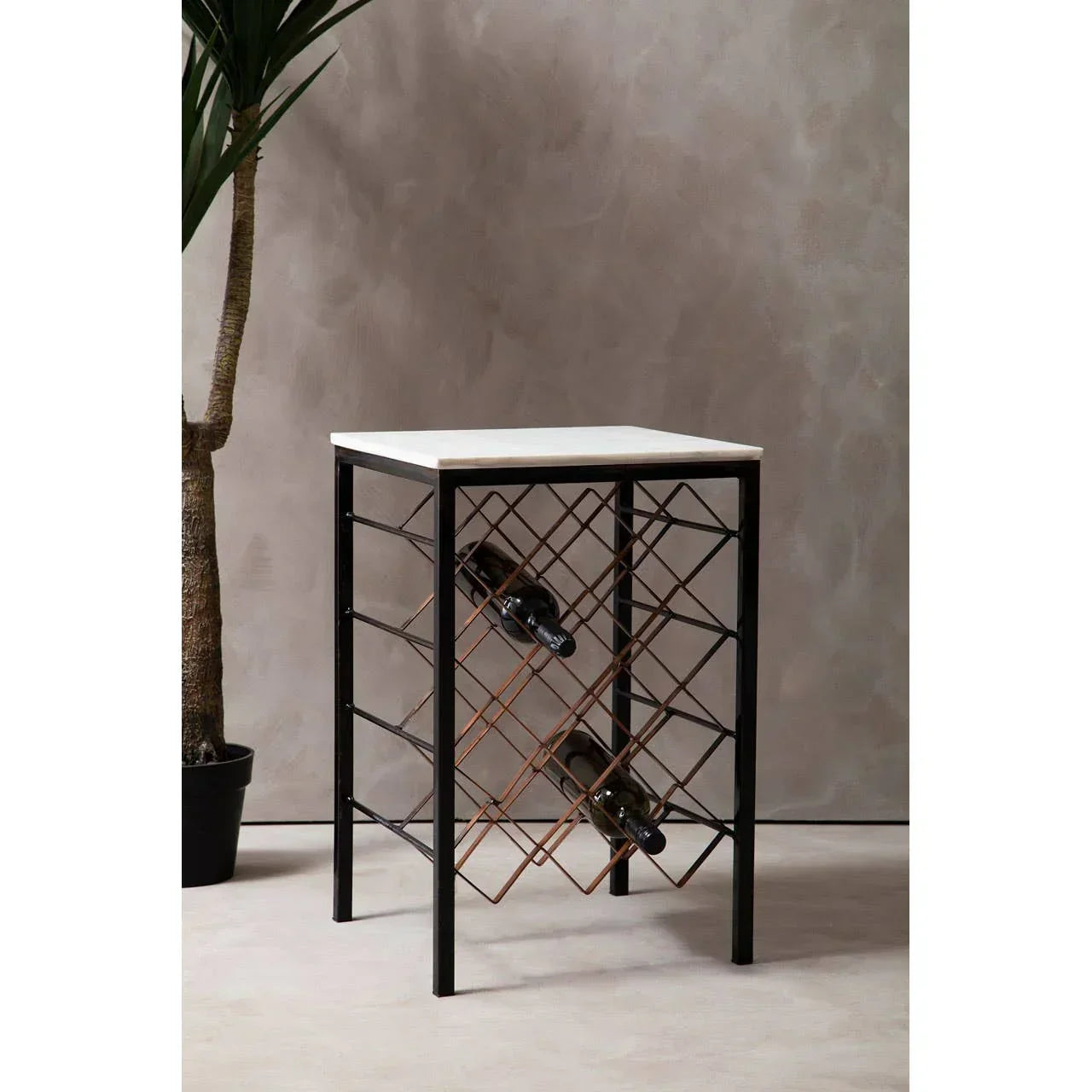 Metal wine rack table with marble top and crisscross storage holds wine bottles