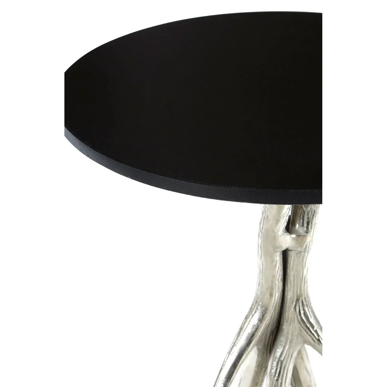 Round black side table with silver branch-style metal legs, close-up angle
