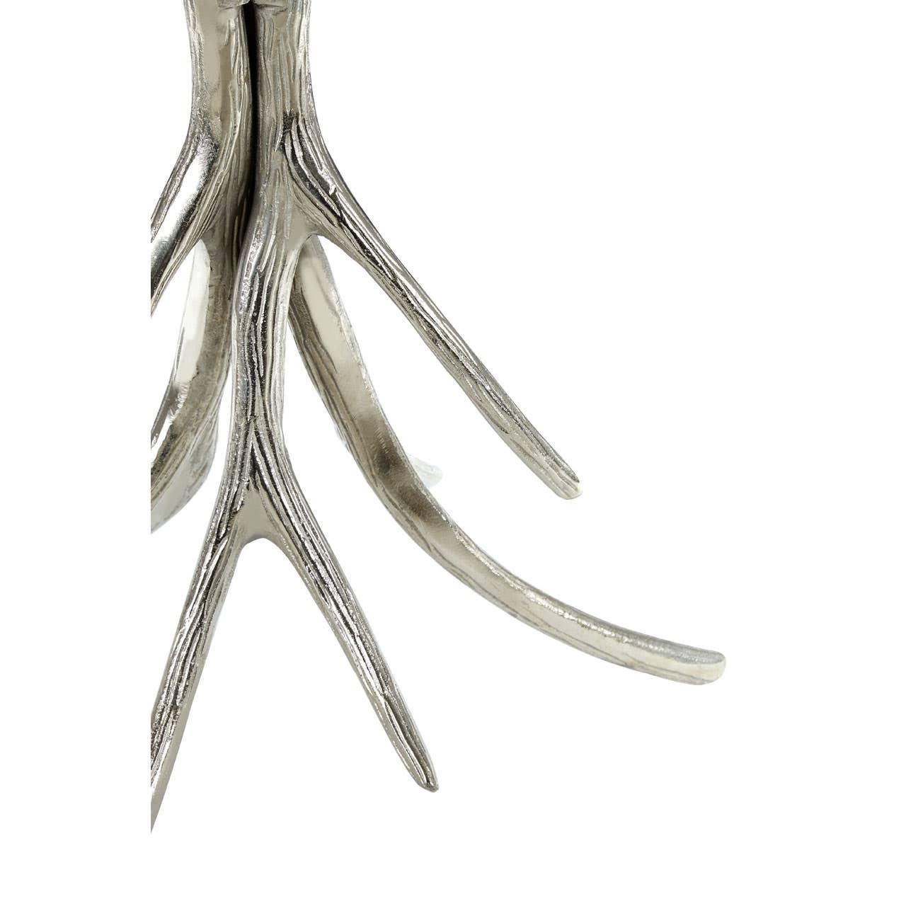 Close-up of silver metal antler table leg with textured finish