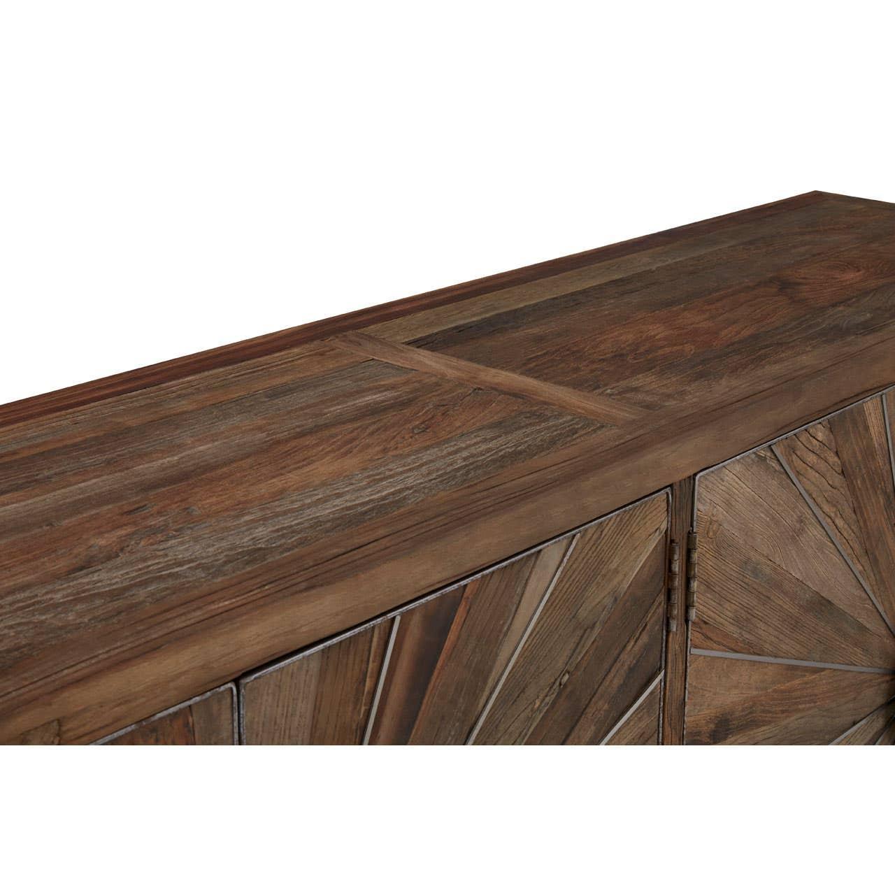 Brown wooden sideboard with geometric patterned doors and rustic finish, angled top view