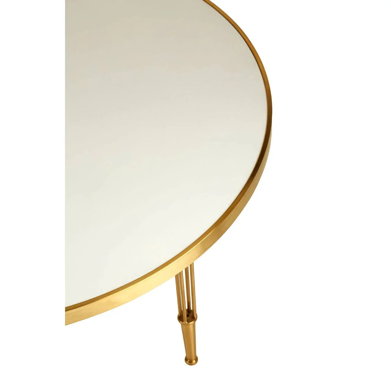 Round glass coffee table with gold metal frame and leg, close-up