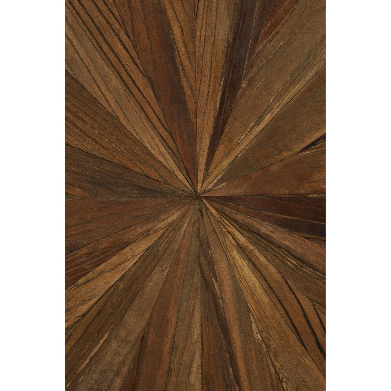 Close up of wooden dining table top with geometric starburst pattern in natural brown tones