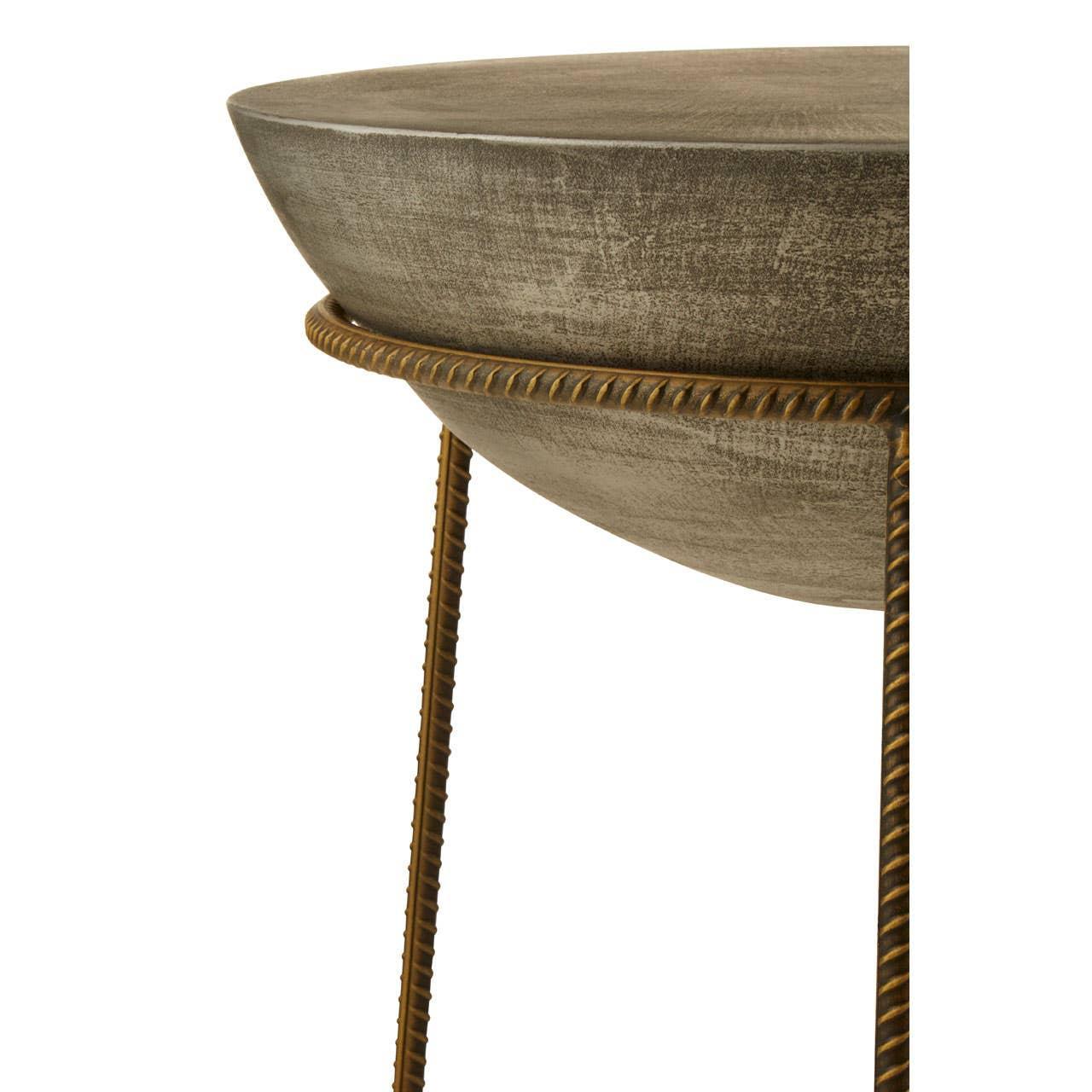 Round metal side table with distressed finish and gold twisted legs, close-up view