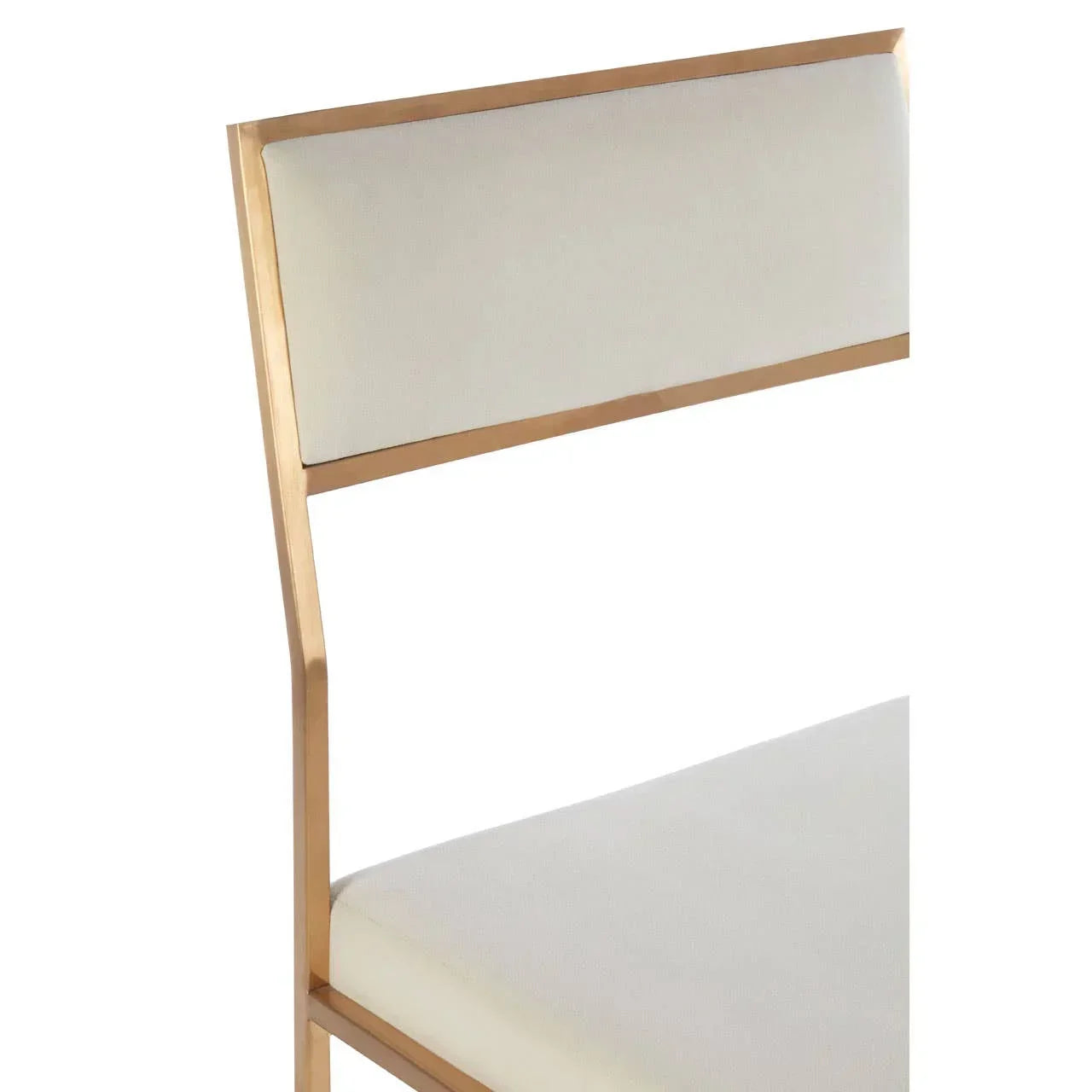 Cream upholstered dining chair with gold metal frame, close up of backrest and seat