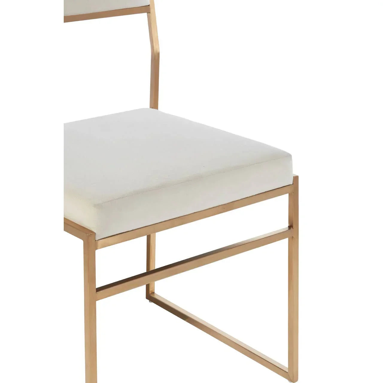 Modern dining chair with cream cushion and gold metal frame, side angle view