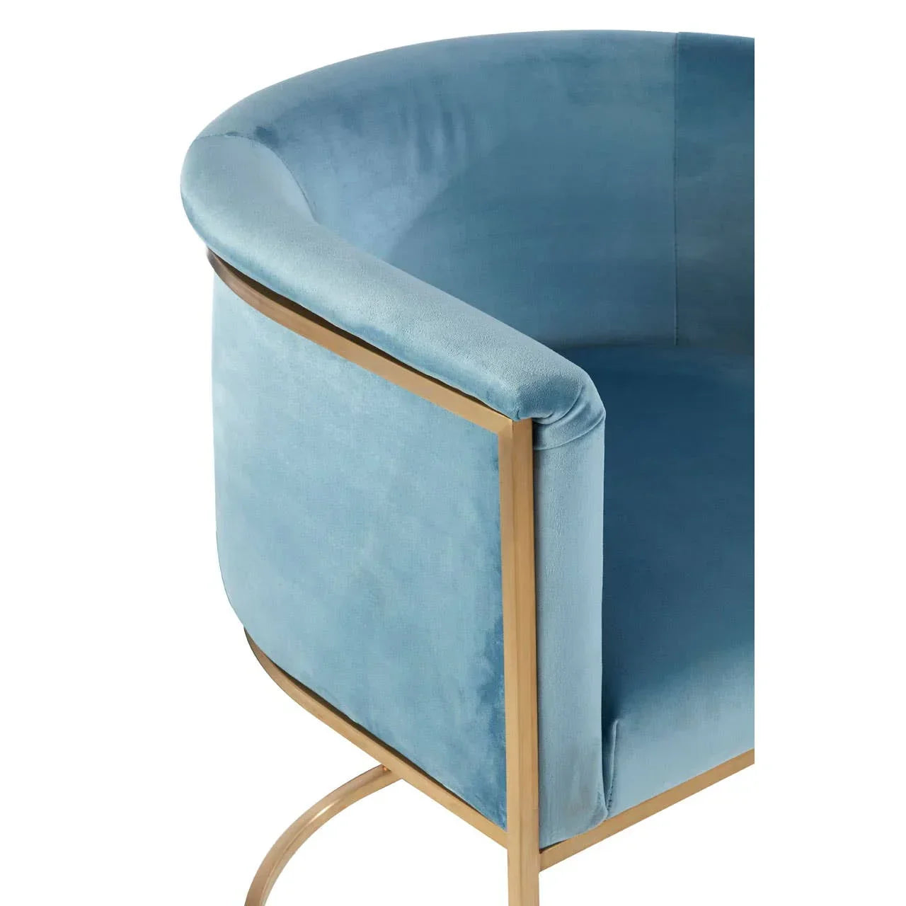 Blue velvet accent chair with gold metal frame, shown close-up from side angle